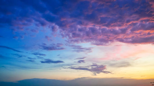 Low angle view of dramatic sky during sunset