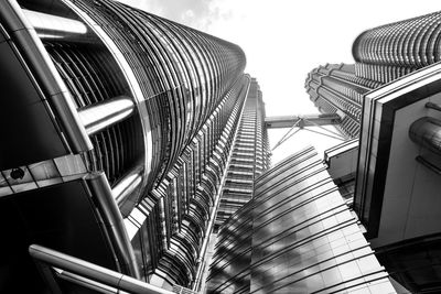 Low angle view of modern office buildings against sky