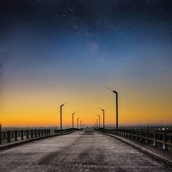 Road against sky at night