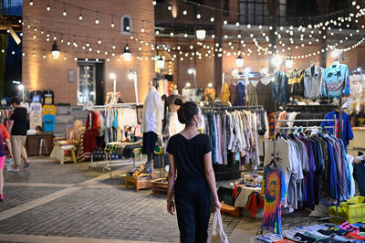 Series photo of young women shopping in night street market , chiang mai north of thailand