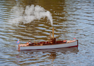 Remote controlled ship model is remote controlled on a lake