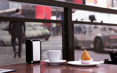 Close-up of coffee served on table at cafe