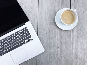 High angle view of coffee cup on table