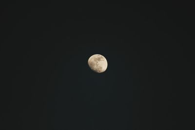 Low angle view of moon against clear sky at night