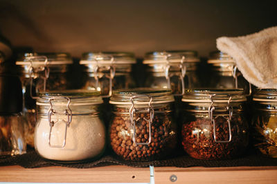 Close-up of ice cream in glass jar on table