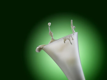 Close-up of hanging against white background