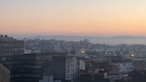 High angle view of townscape against sky during sunset