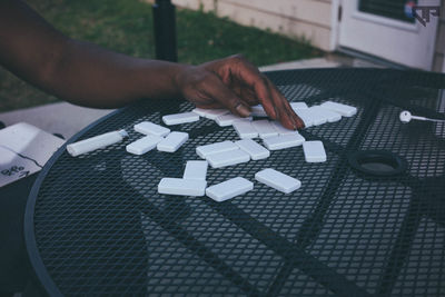 High angle view of person playing dominoes