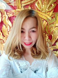 Portrait of smiling girl on bed