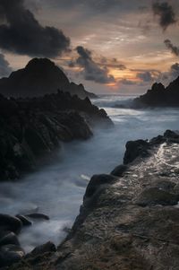 Scenic view of sea against dramatic sky