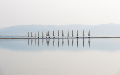 After the rain at the beach - long exposure of beach umbrellas at poetto, cagliari, sardinia