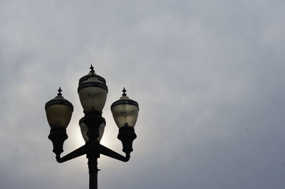 Low angle view of street light against sky