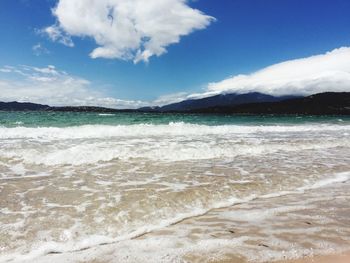 Scenic view of beach against sky