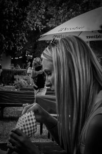 Portrait of woman sitting outdoors