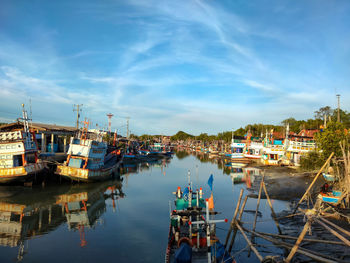 Boats moored at harbor