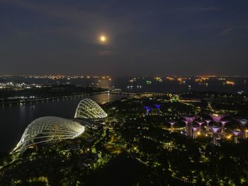 Aerial view of city lit up at night