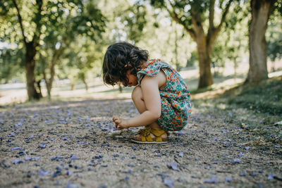 Side view of girl playing outdoors