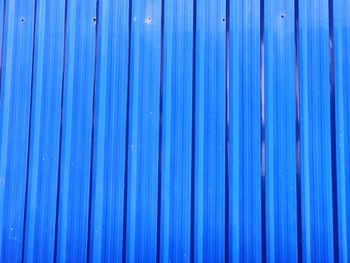 Full frame shot of blue metallic fence