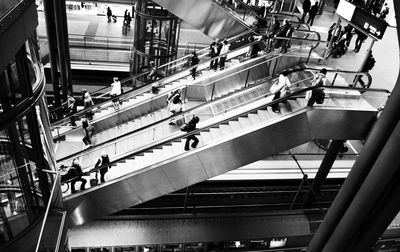 High angle view of people on escalator in building