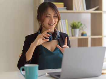 Smiling businesswoman talking on video call