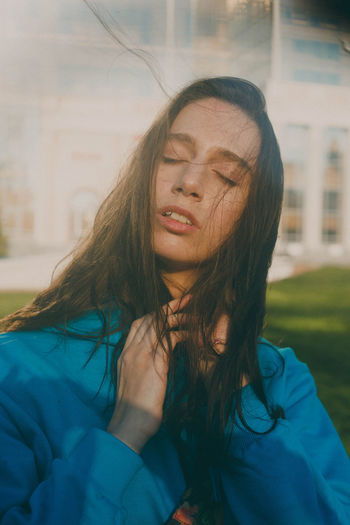 PORTRAIT OF WOMAN WITH EYES CLOSED