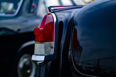 Close-up of car on road