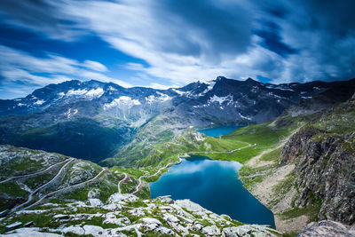 Scenic view of lake and mountains against sky