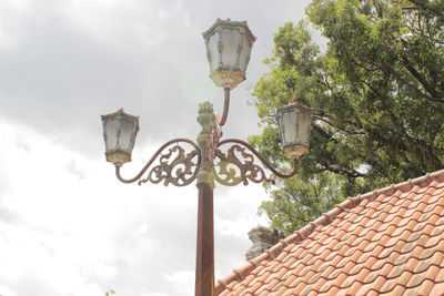 Low angle view of street light against sky