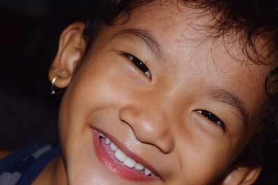 Close-up portrait of smiling cute girl