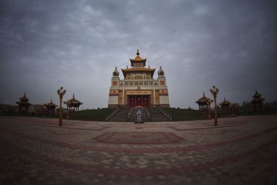 Built structure against cloudy sky