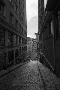 Alley amidst buildings in city