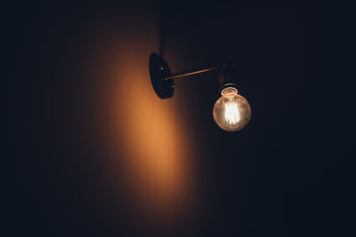 Close-up of illuminated electric lamp