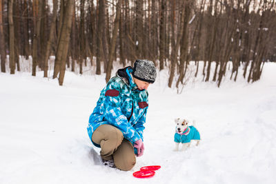 People playing on snow covered land