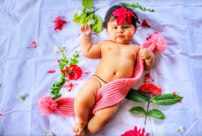 Young woman lying down on plant