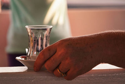 Close-up of hand holding drink