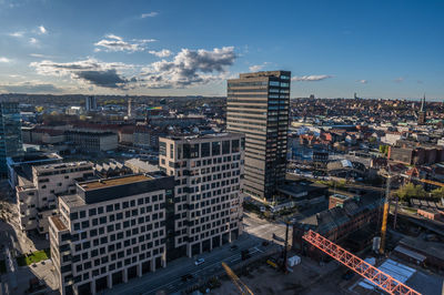 High angle view of buildings in city against sky