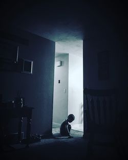 Man in illuminated room