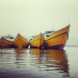 Calm sea with buildings in background