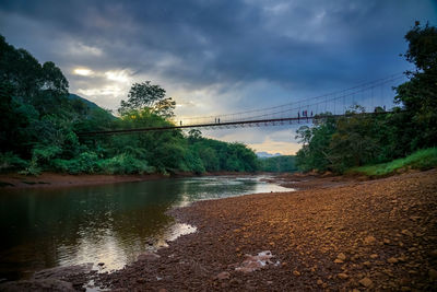 Bridge over river against sky