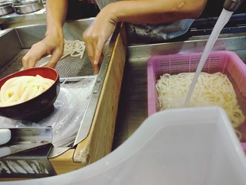 Midsection of person preparing food