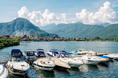 Sailboats moored in bay