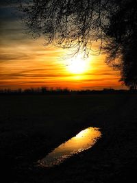 Scenic view of landscape against sky during sunset