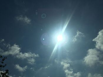 Low angle view of sun in sky