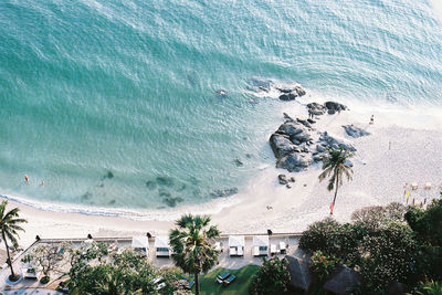 High angle view of beach by sea against sky