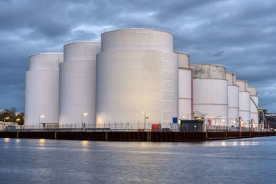 Storage tanks for fossil fuels at dusk seen in berlin