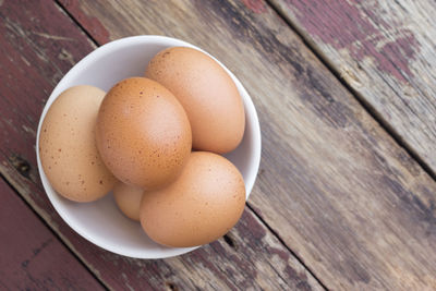 High angle view of eggs in container on table