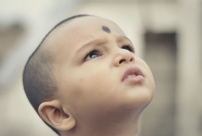 Close-up of boy looking away