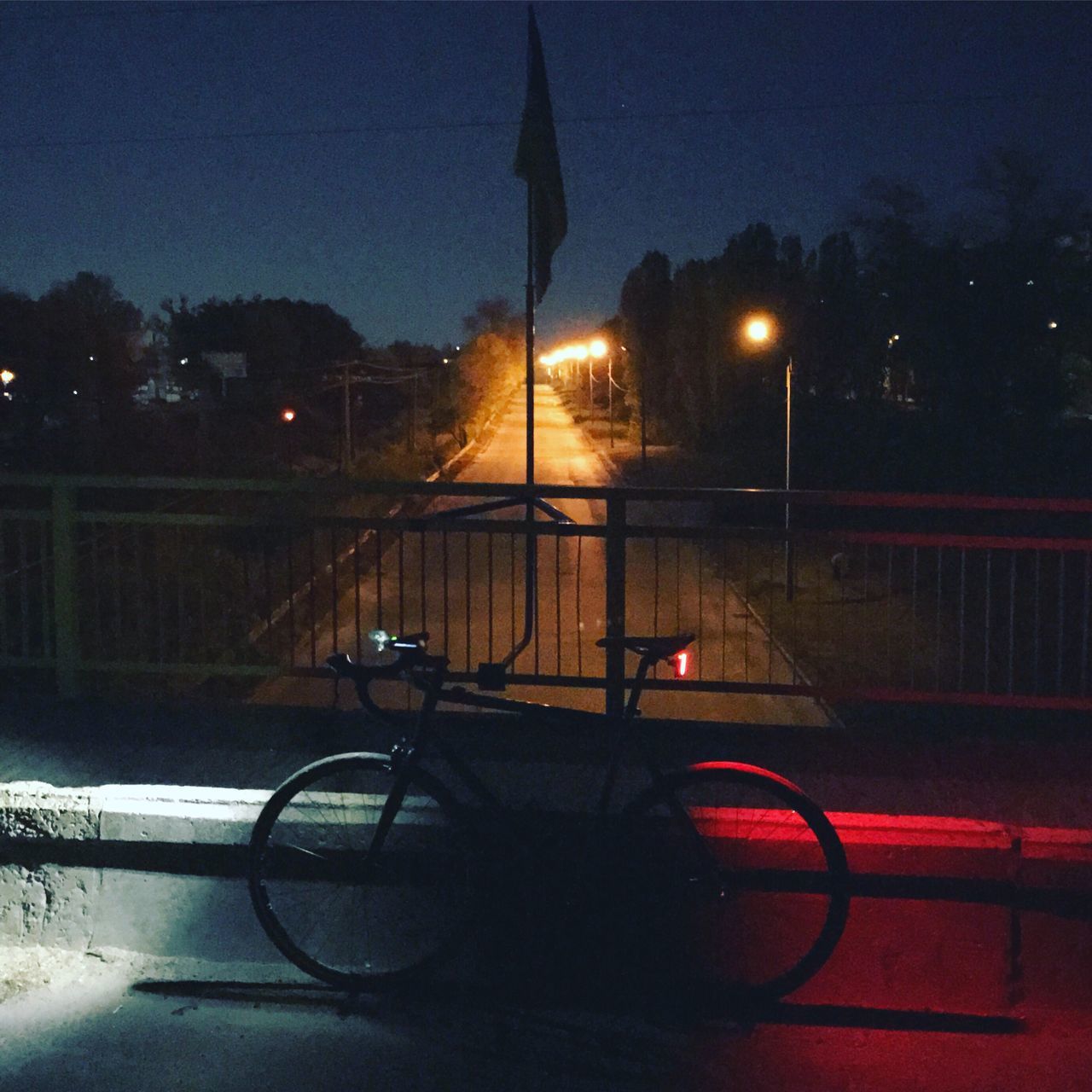 transportation, mode of transport, street light, land vehicle, illuminated, stationary, water, parked, lens flare, dark, outdoors, outline, no people, cycle