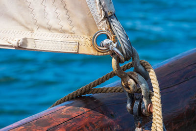 Close-up of rope tied to bollard