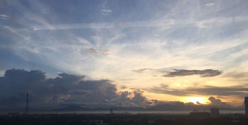 Low angle view of silhouette landscape against sky during sunset